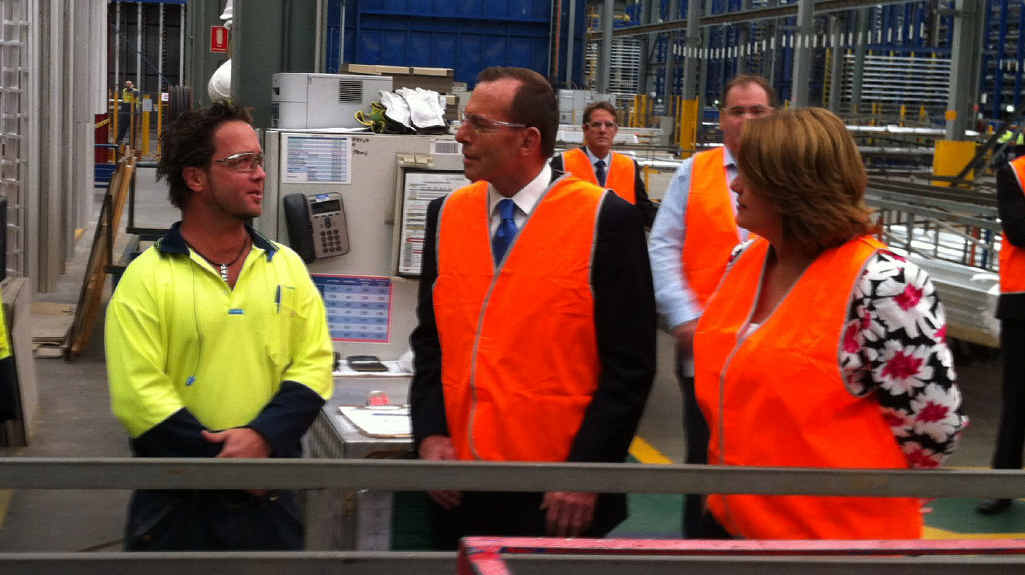 MEET AND GREET: Tony Abbott and Teresa Harding talk with an employee at Capral Aluminium. MEET AND GREET: Tony Abbott and Teresa Harding talk with an employee at Capral Aluminium.
