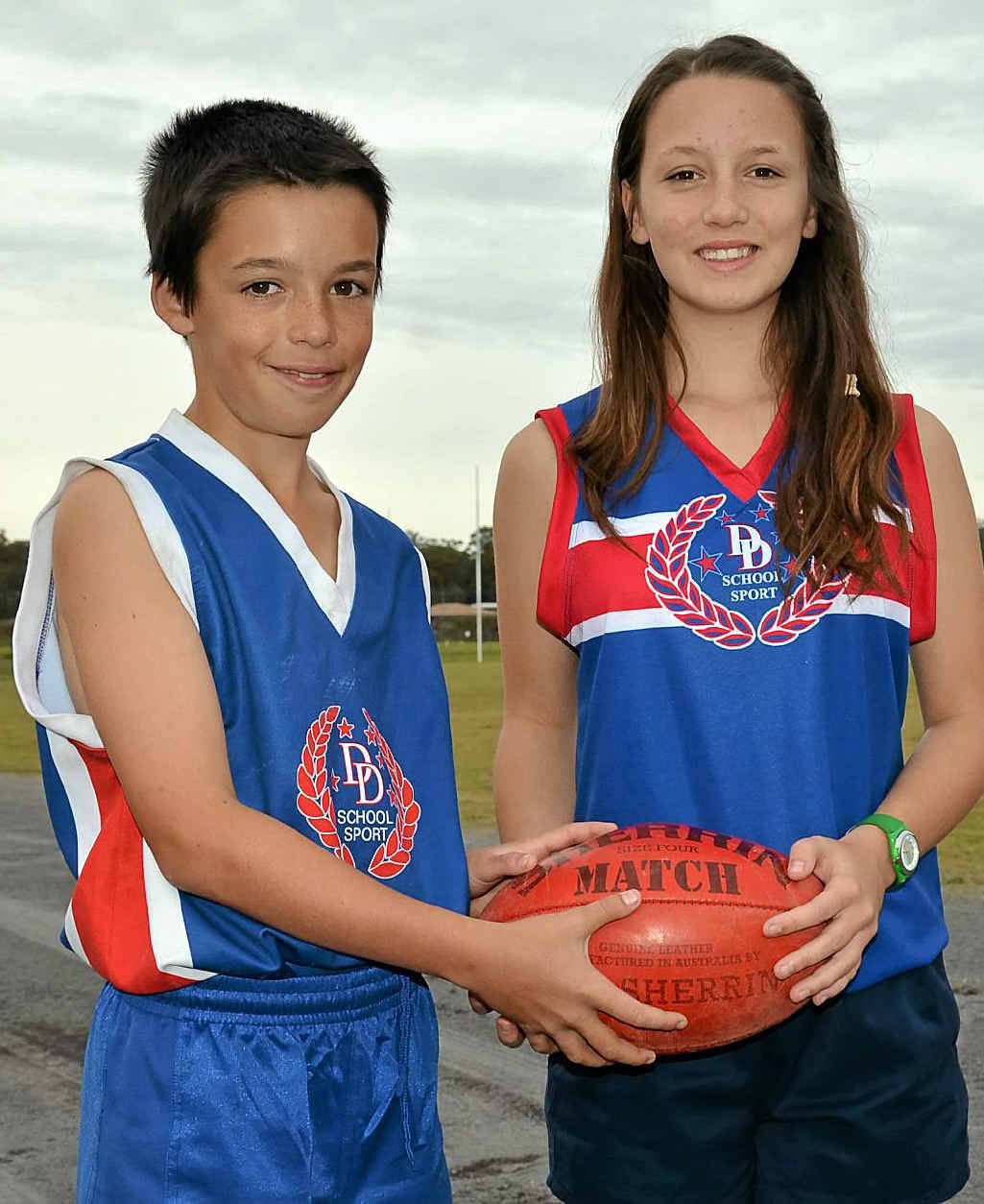 Jaiden and Montana Fidge proudly wear their Darling Downs Australian Rules rep shirts.