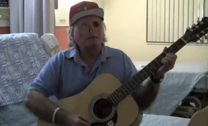 Ronald Poppo playing the guitar. Ronald Poppo playing the guitar.