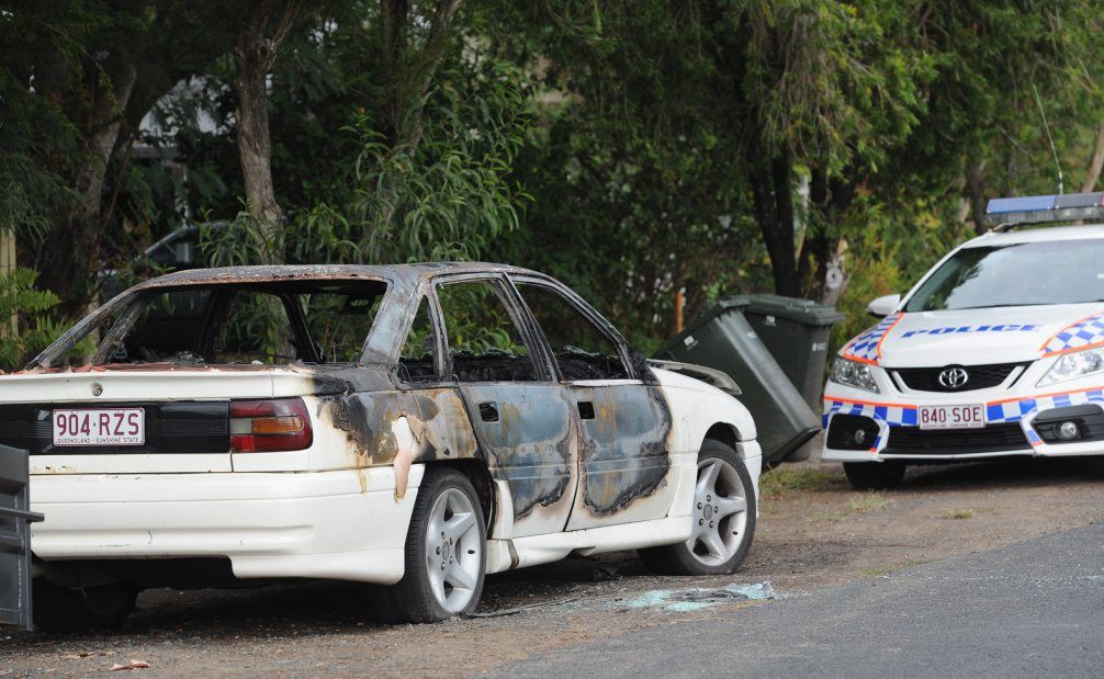 The burnt-out car in Urangan's Hibiscus St is under police guard on Friday morning. The burnt-out car in Urangan's Hibiscus St is under police guard on Friday morning.