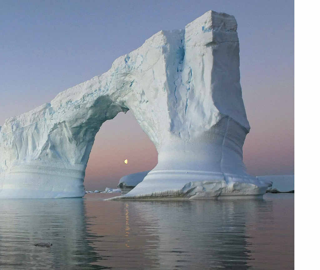 from the Antarctic Peninsula shows an archway destined to fall. from the Antarctic Peninsula shows an archway destined to fall.