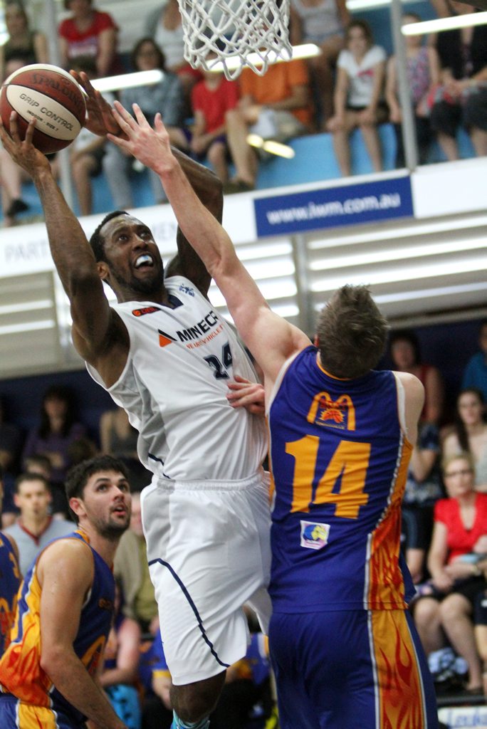 Rocket's Justin Watts gets over the top of the Heat's Matthew Rees. Photo Allan Reinikka / The Morning Bulletin Rocket's Justin Watts gets over the top of the Heat's Matthew Rees. Photo Allan Reinikka / The Morning Bulletin