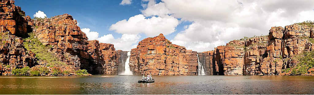 A Zodiac from the Orion expedition cruise ship at King George Falls. A Zodiac from the Orion expedition cruise ship at King George Falls.