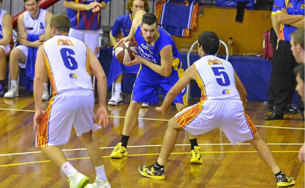 Gladstone Power’s Chris Goulding sizes up his Townsville opponent. Gladstone Power’s Chris Goulding sizes up his Townsville opponent.