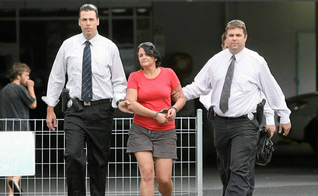 Kerryn Ann Young is led to the Rockhampton watchhouse in 2011. Kerryn Ann Young is led to the Rockhampton watchhouse in 2011.