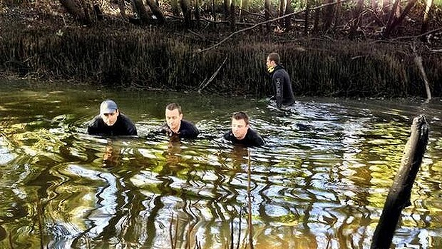 Police divers search Norman Creek at Woolloogabba after the murder of Tony McGrath. Photo: Howie Bennett, Channel 9 via Twitter
Police divers search Norman Creek at Woolloogabba after the murder of Tony McGrath. Photo: Howie Bennett, Channel 9 via Twitter