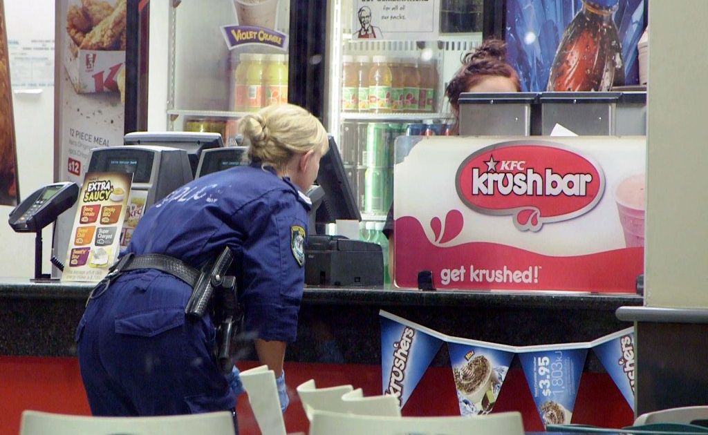 Police search for clues after an armed robbery at KFC Coffs Harbour South on Tuesday night. Photo: Frank Redward Police search for clues after an armed robbery at KFC Coffs Harbour South on Tuesday night. Photo: Frank Redward