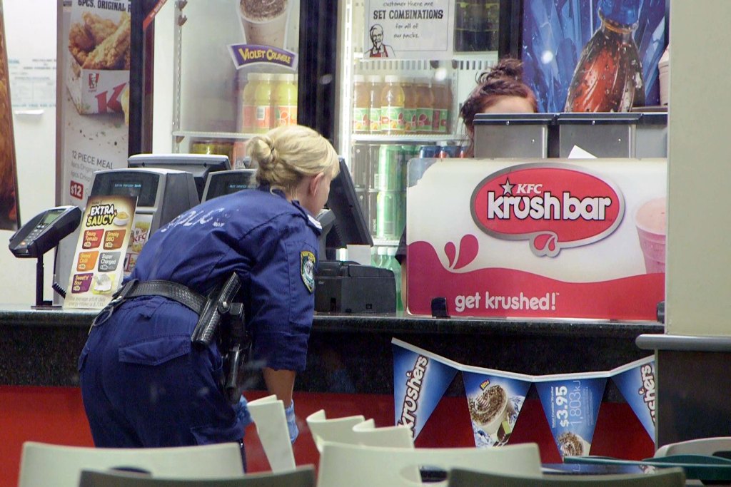 Police search for clues after an armed robbery at KFC Coffs Harbour South on Tuesday night. Photo: Frank Redward Police search for clues after an armed robbery at KFC Coffs Harbour South on Tuesday night. Photo: Frank Redward