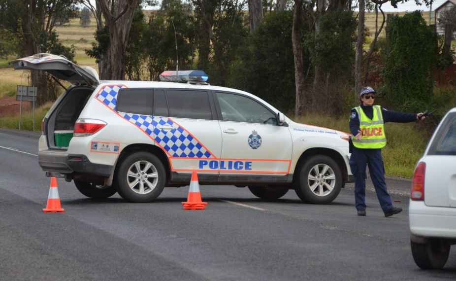 Police redirect traffic from the D'Aguilar Highway after a fatal motorcycle and car crash. Police redirect traffic from the D'Aguilar Highway after a fatal motorcycle and car crash.