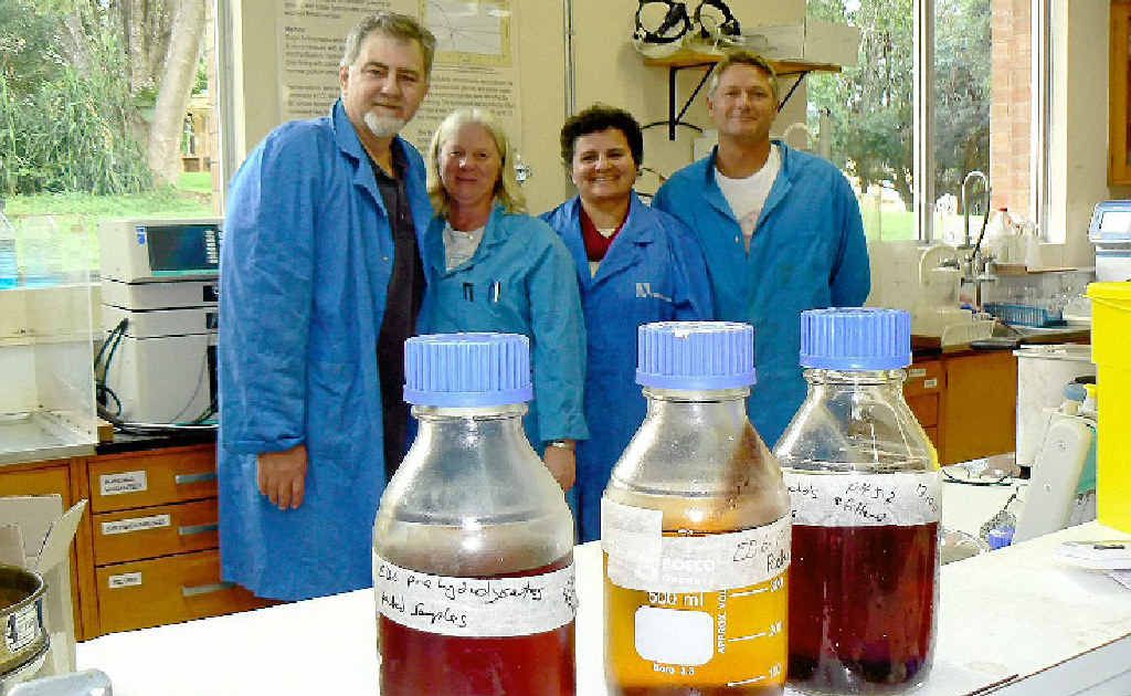 ENERGY FROM WOODY WASTE: NSW DPI Wollongbar’s biofuels team stand behind a range of sugar solutions derived from eucalyptus, sorghum and manure. From left: Team leader Dr Tony Vancov, lab technician Janice Palmer, visiting Brazilian professor Rosanna Schneider and senior post-doc Dr Shane McIntosh. Inset are Dr McIntosh and Ms Palmer inspecting the Parr Reactor, which is used to break down woody biomass into a pulp ready for enzyme digestion. ENERGY FROM WOODY WASTE: NSW DPI Wollongbar’s biofuels team stand behind a range of sugar solutions derived from eucalyptus, sorghum and manure. From left: Team leader Dr Tony Vancov, lab technician Janice Palmer, visiting Brazilian professor Rosanna Schneider and senior post-doc Dr Shane McIntosh. Inset are Dr McIntosh and Ms Palmer inspecting the Parr Reactor, which is used to break down woody biomass into a pulp ready for enzyme digestion.