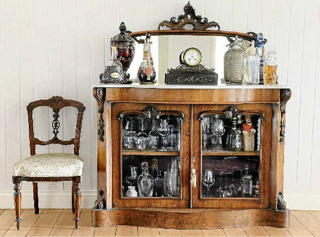 A Victorian sideboard bought from auction and a French clock also bought at an auction. A Victorian sideboard bought from auction and a French clock also bought at an auction.