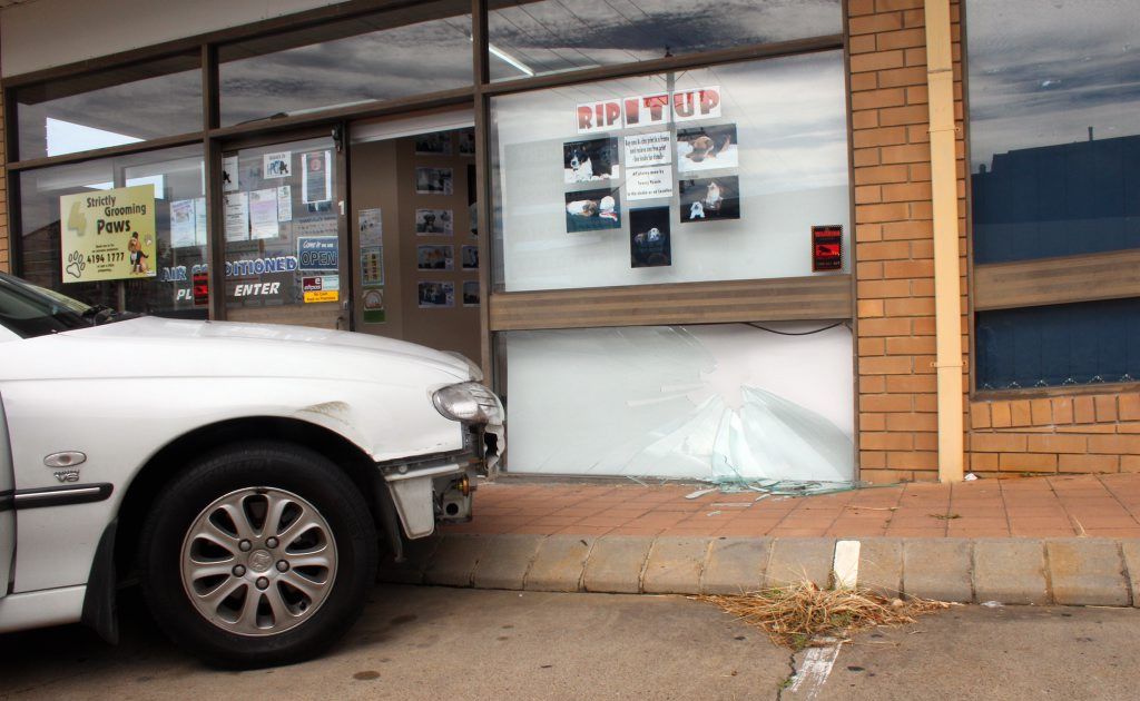 A Holden Commodore hit the front window of a Hervey Bay shop. A Holden Commodore hit the front window of a Hervey Bay shop.