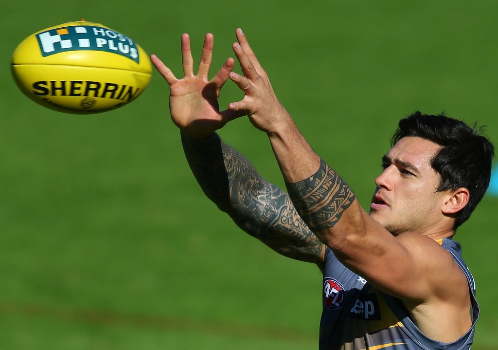 Aaron Edwards marks the ball during a Richmond Tigers AFL training session at ME Bank Centre on May 2, 2013 in Melbourne, Australia. Aaron Edwards marks the ball during a Richmond Tigers AFL training session at ME Bank Centre on May 2, 2013 in Melbourne, Australia.
