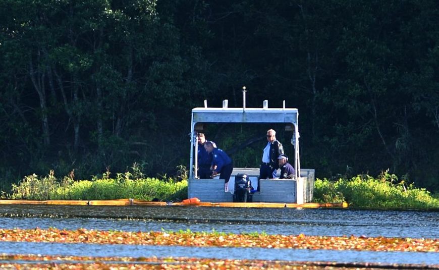 Police divers on the water at Clarrie Hall Dam, near Uki. Police divers on the water at Clarrie Hall Dam, near Uki.