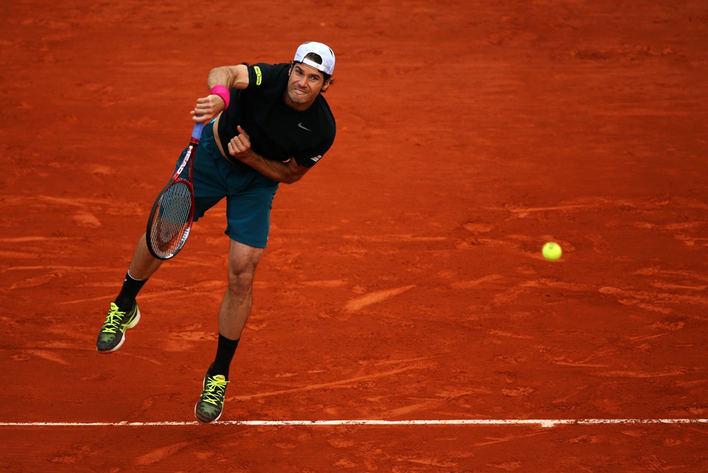 Tommy Haas of Germany serves during his Men's Singles match against Mikhail Youzhny of Russian Federation on day nine of the French Open at Roland Garros on June 3, 2013 in Paris, France. Tommy Haas of Germany serves during his Men's Singles match against Mikhail Youzhny of Russian Federation on day nine of the French Open at Roland Garros on June 3, 2013 in Paris, France.