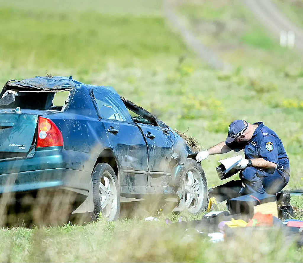 ANALYSIS: crime scene investigation officer examines the Mitsubishi Magna involved in a fatal car crash at McDonalds Bridge Rd and Martins Rd at Dyraaba. The driver of the Magna has now been charged with driving while disqualified. ANALYSIS: crime scene investigation officer examines the Mitsubishi Magna involved in a fatal car crash at McDonalds Bridge Rd and Martins Rd at Dyraaba. The driver of the Magna has now been charged with driving while disqualified.