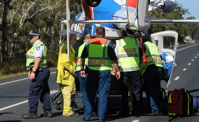 Emergency service crews lift an injured woman into the AGL Action Rescue Helicopter after a four-vehicle crash at Dundathu on Tuesday morning. Emergency service crews lift an injured woman into the AGL Action Rescue Helicopter after a four-vehicle crash at Dundathu on Tuesday morning.