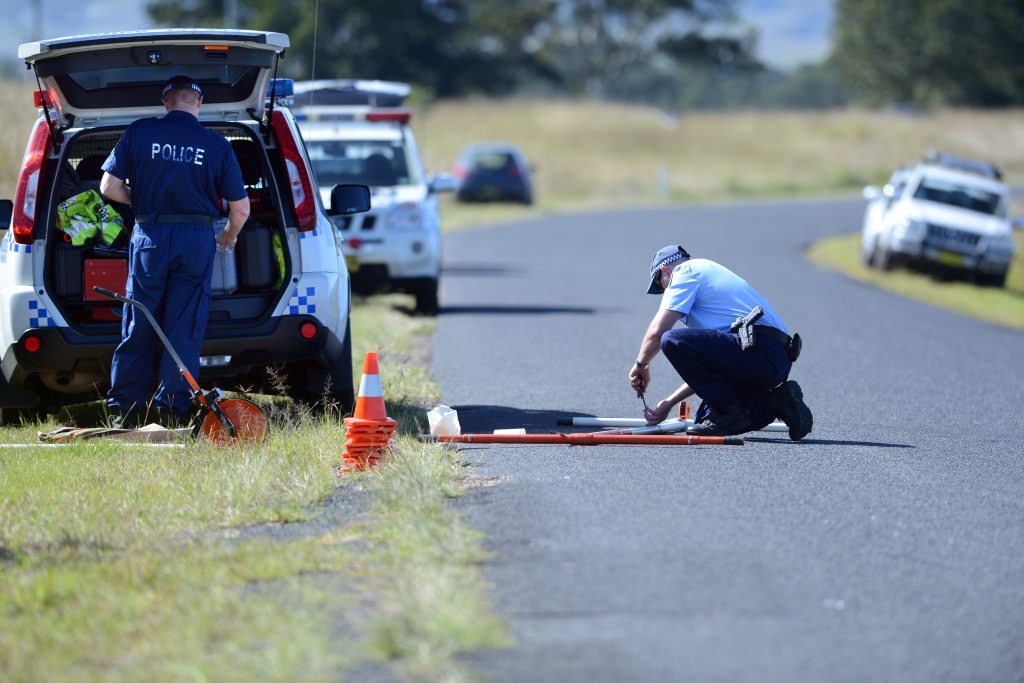 A crime scene investigation officer examines a car that was invovled in a fatal car crash at the intersection of McDonalds Bridge Road ans Martins Road at Dyraaba. Photo Cathy Adams / The Northern Star A crime scene investigation officer examines a car that was invovled in a fatal car crash at the intersection of McDonalds Bridge Road ans Martins Road at Dyraaba. Photo Cathy Adams / The Northern Star