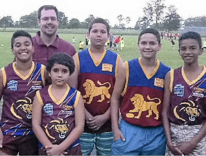 AUSSIE RULES: Looking forward to future successes are Casino junior players (from left) Solomon Torrens, A.J. Williams, coach David Heath, Harold Torrens, Antonio Binge, Audley Hickling and Taye Torrens. AUSSIE RULES: Looking forward to future successes are Casino junior players (from left) Solomon Torrens, A.J. Williams, coach David Heath, Harold Torrens, Antonio Binge, Audley Hickling and Taye Torrens.