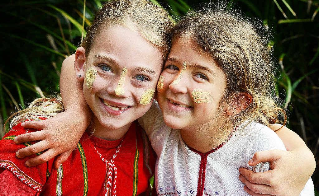 RAISING FUNDS: Dressed in traditional ethnic Burmese Karen dress as part of Rice Day are St Joseph’s Primary School Alstonville pupils Molly Hipkins, 7 and Sarah Fivaz, 6, two of the school’s pupils raising money for displaced Burmese refugees. RAISING FUNDS: Dressed in traditional ethnic Burmese Karen dress as part of Rice Day are St Joseph’s Primary School Alstonville pupils Molly Hipkins, 7 and Sarah Fivaz, 6, two of the school’s pupils raising money for displaced Burmese refugees.