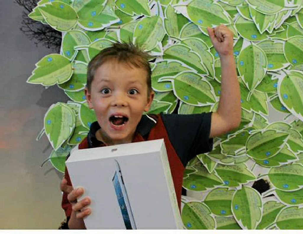Thomas Paul, 7, celebrates after winning an iPad in the GLNG Ecofest competition. Thomas Paul, 7, celebrates after winning an iPad in the GLNG Ecofest competition.