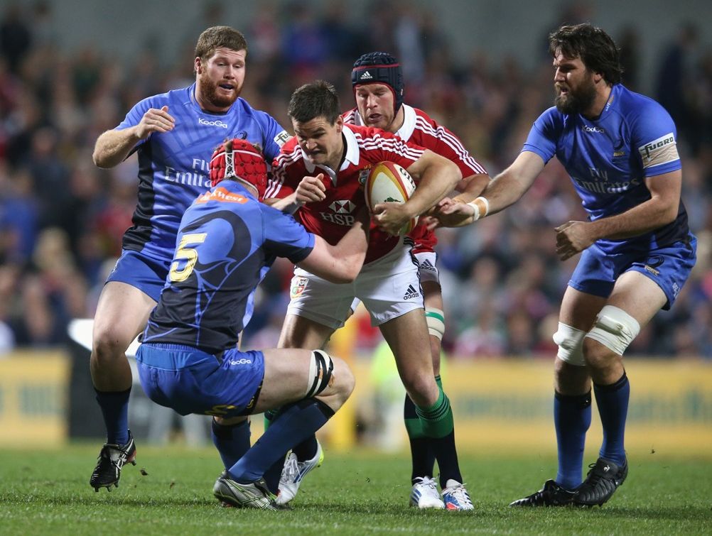 Johnny Sexton of the Lions is tackled during the tour match between the Western Force and the British & Irish Lions at Patersons Stadium on June 5, 2013 in Perth, Australia. Johnny Sexton of the Lions is tackled during the tour match between the Western Force and the British & Irish Lions at Patersons Stadium on June 5, 2013 in Perth, Australia.