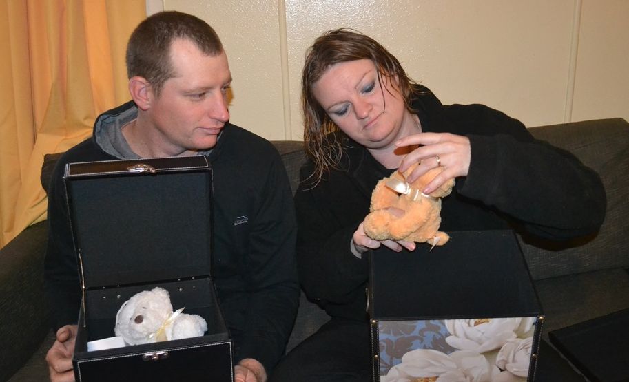 HARD LOSS: Tammy Skinner and her husband Damian look through the memory boxes they have created to remember their two babies lost in separate miscarriages. HARD LOSS: Tammy Skinner and her husband Damian look through the memory boxes they have created to remember their two babies lost in separate miscarriages.