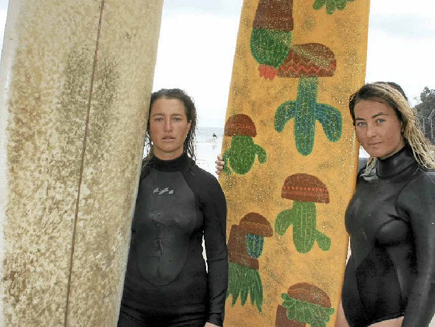 SAD SURFERS: Pictured at The Pass yesterday were longboarders, Lauren Brophy, 27, left, of Yamba and Maria Nilsson, 28, of Byron Bay. SAD SURFERS: Pictured at The Pass yesterday were longboarders, Lauren Brophy, 27, left, of Yamba and Maria Nilsson, 28, of Byron Bay.