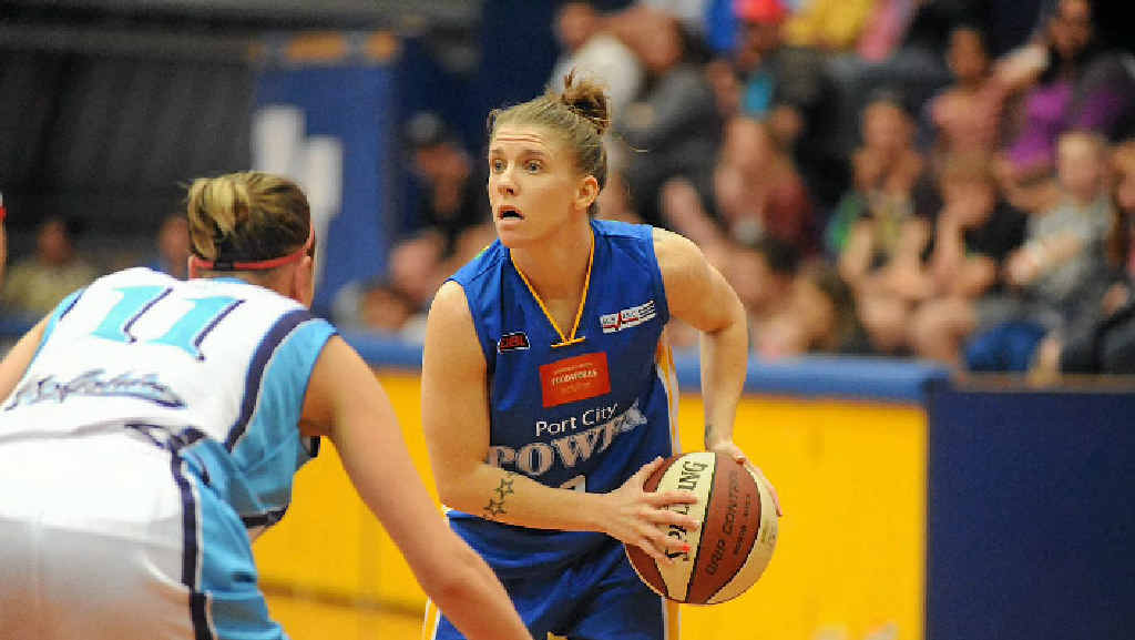 Power player Natalie Hurst in action against Cairns Dolphins. Power player Natalie Hurst in action against Cairns Dolphins.