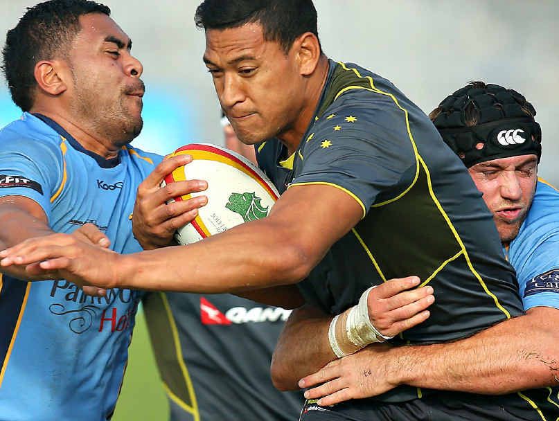 New Wallaby Israel Folau, centre, gets tackled by Stingrays Isaac Schwenke, left, and Tom Beattie during a training session on Tuesday. New Wallaby Israel Folau, centre, gets tackled by Stingrays Isaac Schwenke, left, and Tom Beattie during a training session on Tuesday.