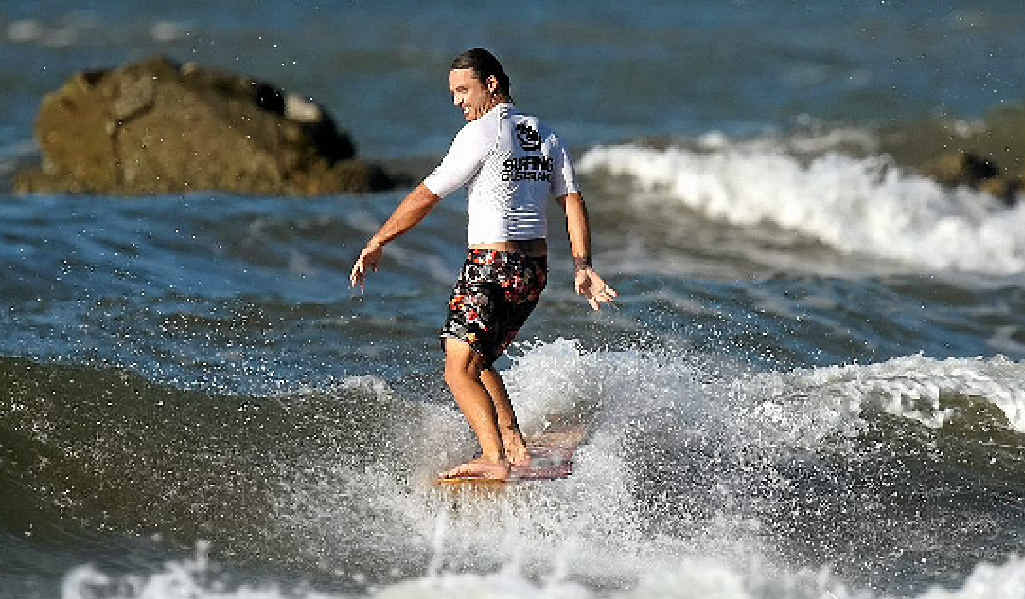 Blake Hyland perches himself on the nose of his board at last year’s Agnes Water event. Blake Hyland perches himself on the nose of his board at last year’s Agnes Water event.