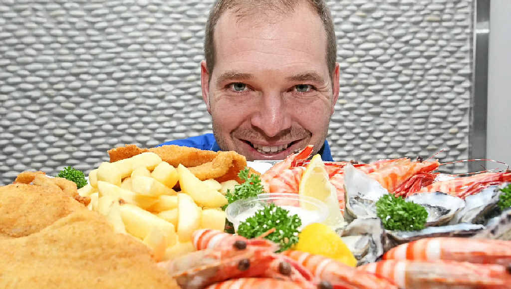 Michael Thomas, owner of Port Cartwright Seafoods, looks over an award-winning platter. Michael Thomas, owner of Port Cartwright Seafoods, looks over an award-winning platter.