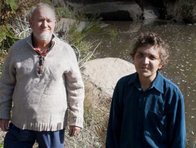 Bill and Joshua Lynam, pictured at the waterhole where Joshua, his brother Joel Lynam and mates Vincent Summers and Bryan Wilmot spent part of the weekend before celebrating a friend's birthday. The four fell ill after an apparent alcohol poisoning incident. Bill and Joshua Lynam, pictured at the waterhole where Joshua, his brother Joel Lynam and mates Vincent Summers and Bryan Wilmot spent part of the weekend before celebrating a friend's birthday. The four fell ill after an apparent alcohol poisoning incident.