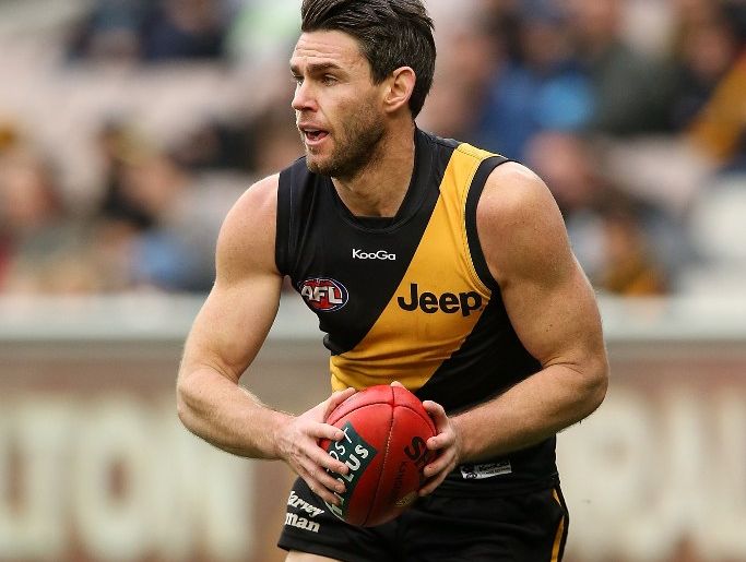 Chris Newman of the Tigers runs with the ball during the round 12 AFL match between the Richmond Tigers and the Adelaide Crows at Melbourne Cricket Ground on June 15, 2013 in Melbourne, Australia. Chris Newman of the Tigers runs with the ball during the round 12 AFL match between the Richmond Tigers and the Adelaide Crows at Melbourne Cricket Ground on June 15, 2013 in Melbourne, Australia.