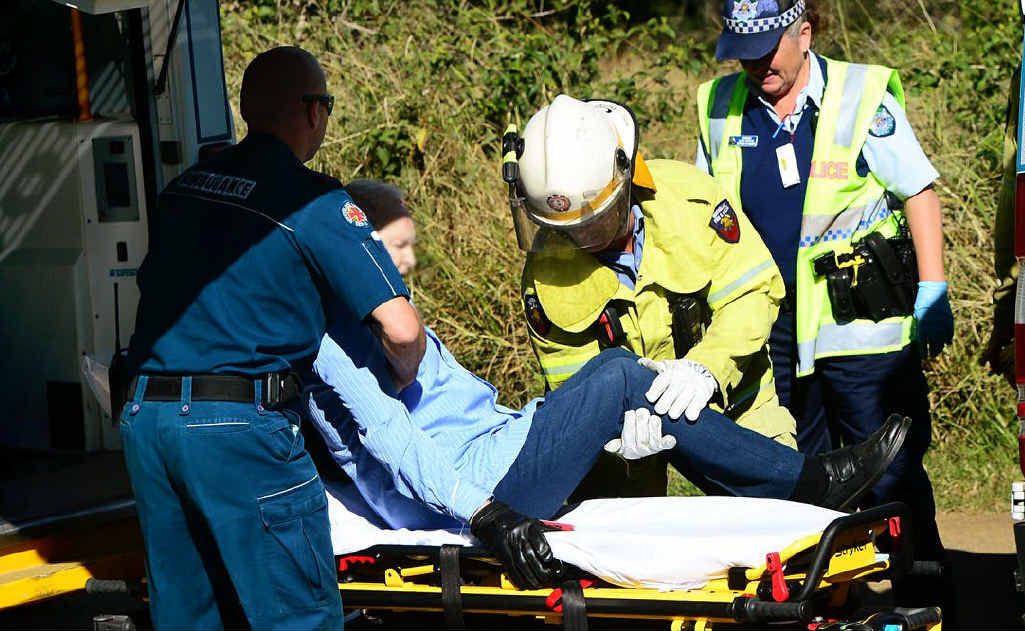 AGED CARE: Paramedics assist an elderly crash victim. AGED CARE: Paramedics assist an elderly crash victim.