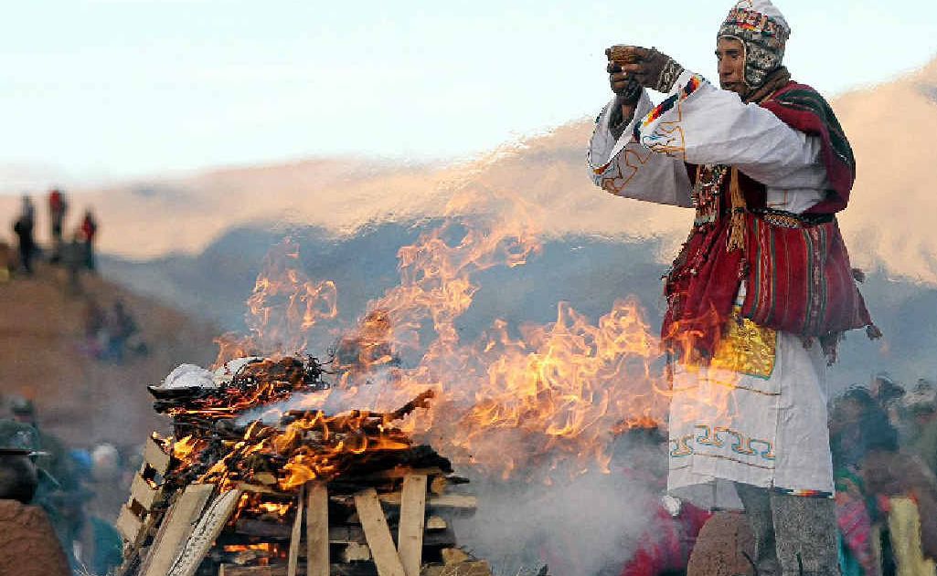NEW START: A religious leader makes an offering during celebrations of the New Year in Tiwanaku, Bolivia. The Aymara, one of the largest indigenous groups in the region, celebrate new year on the winter solstice, the start of the new agricultural cycle. NEW START: A religious leader makes an offering during celebrations of the New Year in Tiwanaku, Bolivia. The Aymara, one of the largest indigenous groups in the region, celebrate new year on the winter solstice, the start of the new agricultural cycle.