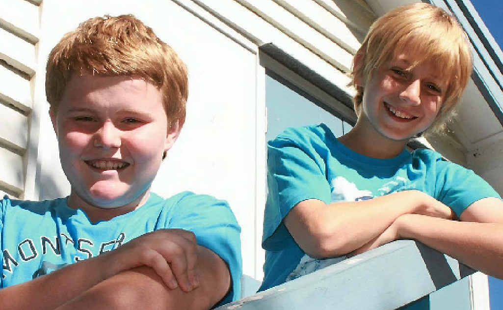 Joel Truelson, 12, and Noah Curtis, 11, will hold a Blue Dress Day at Bouldercombe State School today, raising money to fight Motor Neurone Disease. Joel Truelson, 12, and Noah Curtis, 11, will hold a Blue Dress Day at Bouldercombe State School today, raising money to fight Motor Neurone Disease.