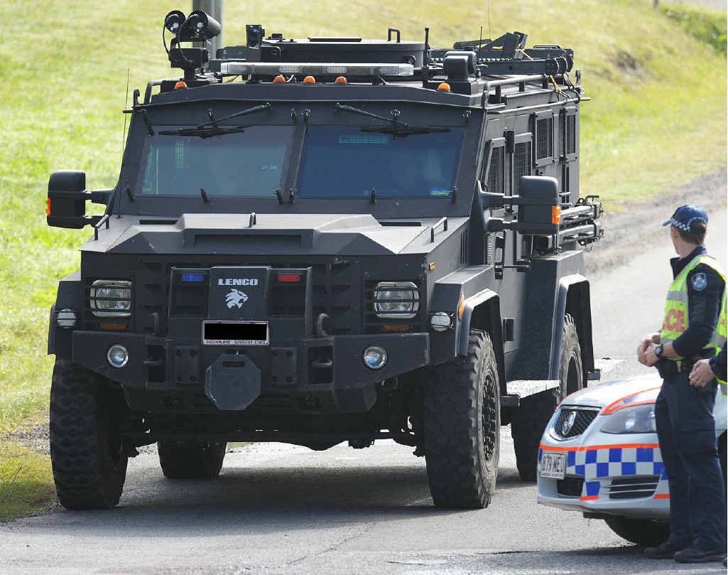 Police arrive at the siege scene. Police arrive at the siege scene.