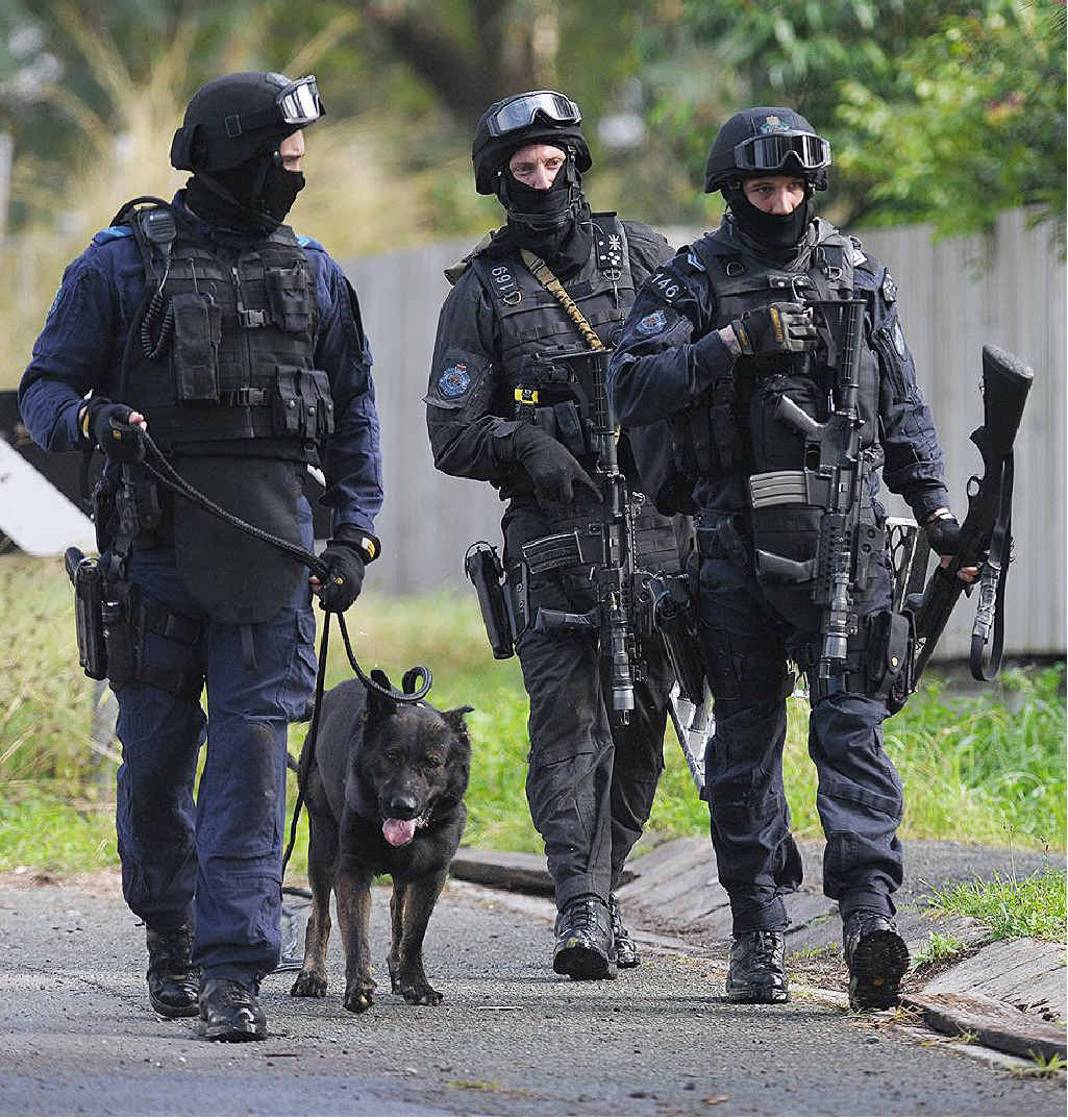 AT THE READY: Special Emergency Response Team police officers at the scene of a siege in Redbank Plains on Saturday morning. AT THE READY: Special Emergency Response Team police officers at the scene of a siege in Redbank Plains on Saturday morning.