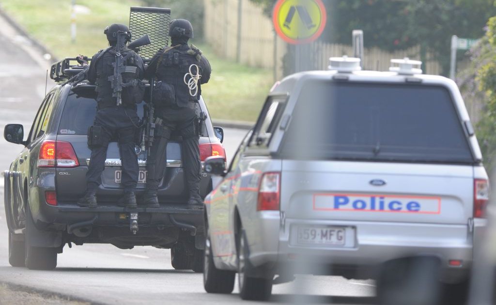 SERT police officers at the scene of last month's siege in Redbank Plains. SERT police officers at the scene of last month's siege in Redbank Plains.