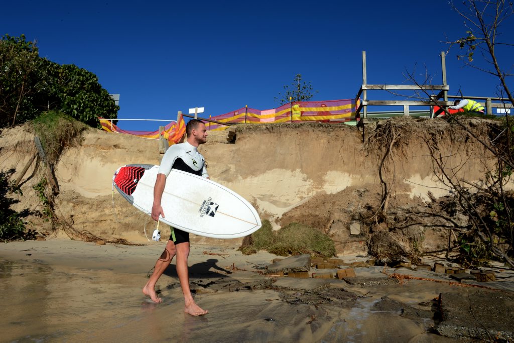 Ben Newman is going for a surf on his holiday at Fingal beach Ben Newman is going for a surf on his holiday at Fingal beach