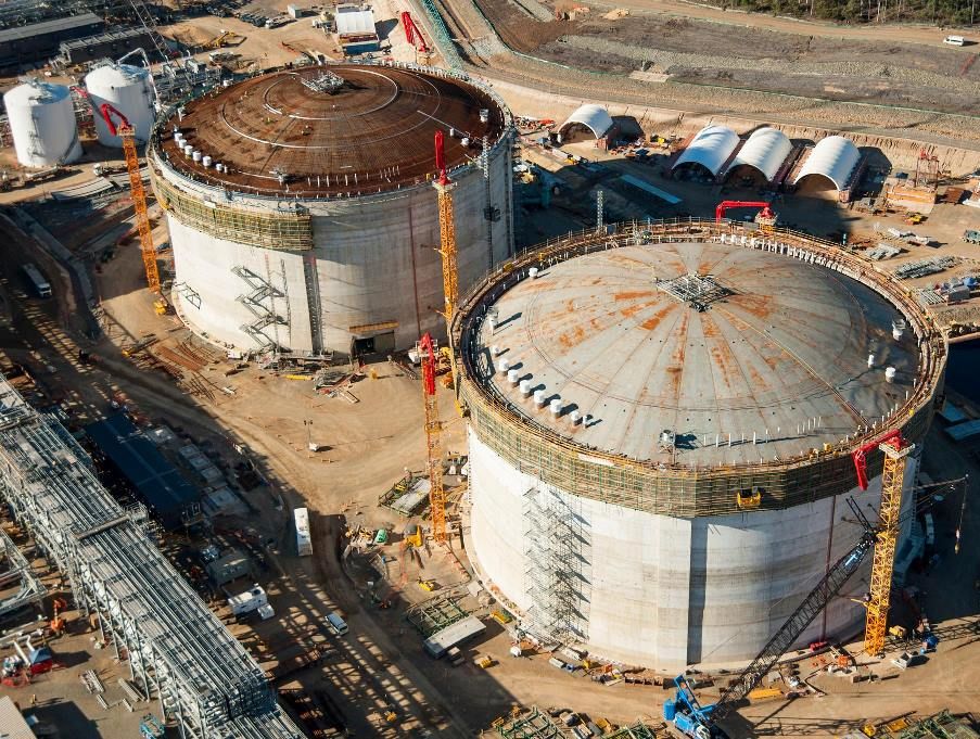 The roof has been raised on QCLNG's second tank (right) on Curtis Island, after the first roof was raised in February. The roof has been raised on QCLNG's second tank (right) on Curtis Island, after the first roof was raised in February.