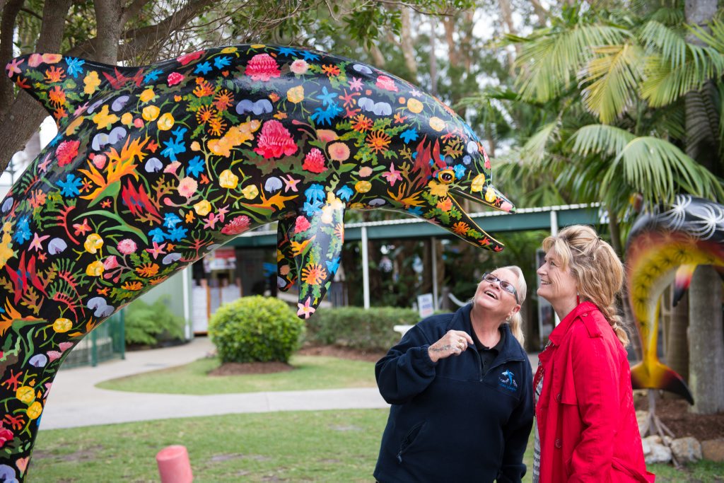 DOLPHIN MAGIC: Glynn Carter and Christina Hyde admiring one of the four statues. Photo: Trevor Veale DOLPHIN MAGIC: Glynn Carter and Christina Hyde admiring one of the four statues. Photo: Trevor Veale