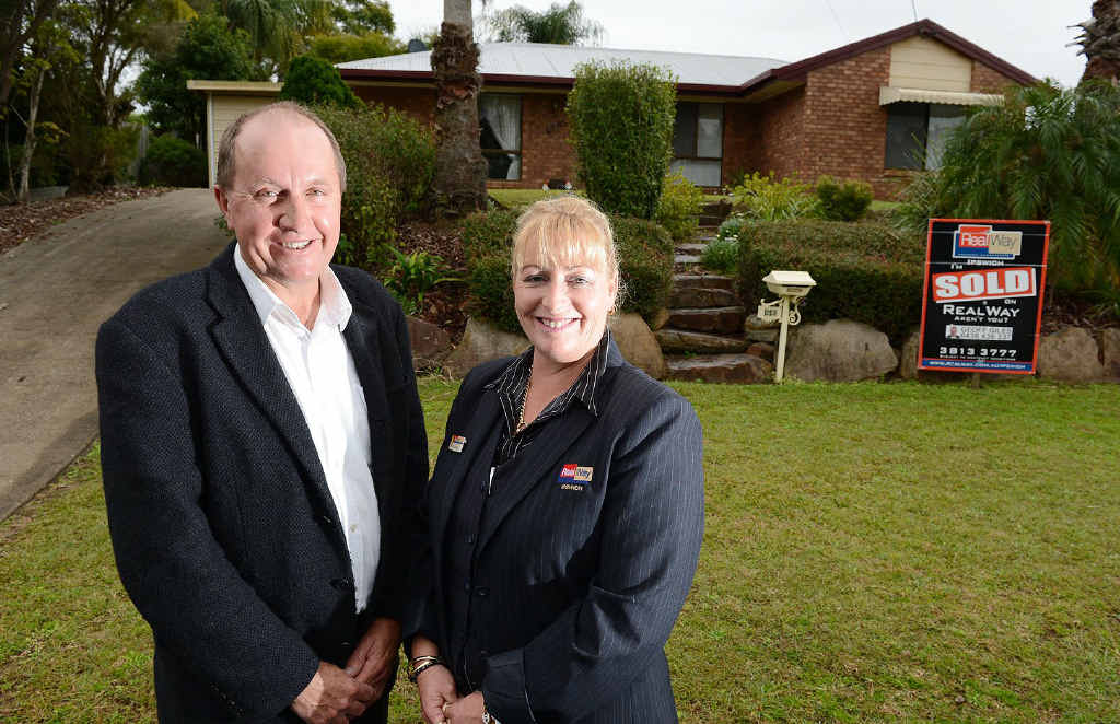 SNAP, SNAP: Realway real estate agents Geoff Giles and Karen Bagenal in front of a Flinders View home. There has been an influx in home buyers snapping up homes selling under $300,000. SNAP, SNAP: Realway real estate agents Geoff Giles and Karen Bagenal in front of a Flinders View home. There has been an influx in home buyers snapping up homes selling under $300,000.