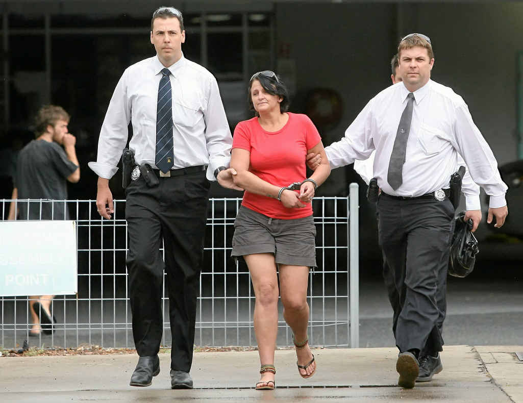 A woman charged with a Gladstone murder is taken into custody by police at the Rockhampton watchhouse. A woman charged with a Gladstone murder is taken into custody by police at the Rockhampton watchhouse.