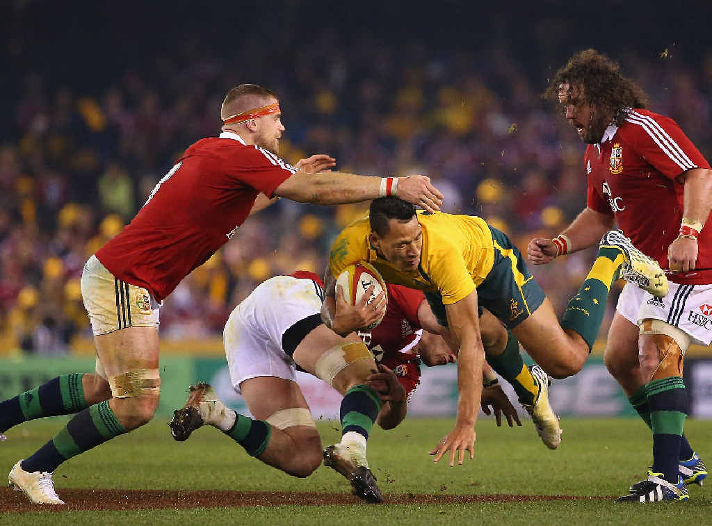 DANGER MAN: The Lions gang up on the Wallabies’ Israel Folau at Melbourne’s Etihad Stadium last night. DANGER MAN: The Lions gang up on the Wallabies’ Israel Folau at Melbourne’s Etihad Stadium last night.