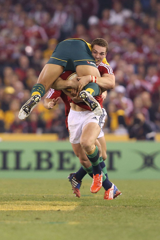 George North of the Lions tackles Israel Folau of the Wallabies during game two of the International Test Series, lifting Folau onto his shoulder and taking him for a run. George North of the Lions tackles Israel Folau of the Wallabies during game two of the International Test Series, lifting Folau onto his shoulder and taking him for a run.