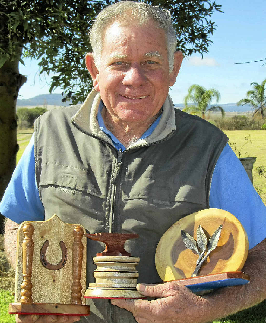 Des Bosworth displaying some of the timber and iron work trophies he has made for the upcoming Brisbane Royal Show in August. Des Bosworth displaying some of the timber and iron work trophies he has made for the upcoming Brisbane Royal Show in August.