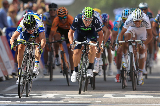 Simon Gerrans (L) of Australia riding for Orica GreenEdge reaches for the line as he wins stage three of the 2013 Tour de France, a 145.5KM road stage from Ajaccio to Calvi Simon Gerrans (L) of Australia riding for Orica GreenEdge reaches for the line as he wins stage three of the 2013 Tour de France, a 145.5KM road stage from Ajaccio to Calvi