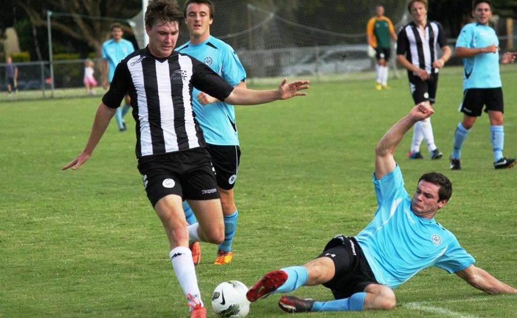 Murwillumbah Football Club striker Alex Thelwal clashes with a defender from Palm Beach Soccer Club. MFC beat Palm Beach 5-0. Murwillumbah Football Club striker Alex Thelwal clashes with a defender from Palm Beach Soccer Club. MFC beat Palm Beach 5-0.